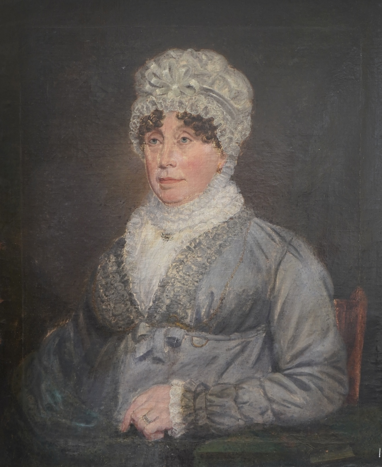 Victorian School, Half length portrait of an elderly lady wearing a lace cap, blouse and a grey dress, unsigned, oil on canvas, ornate gilt frame, 75 x 62cm